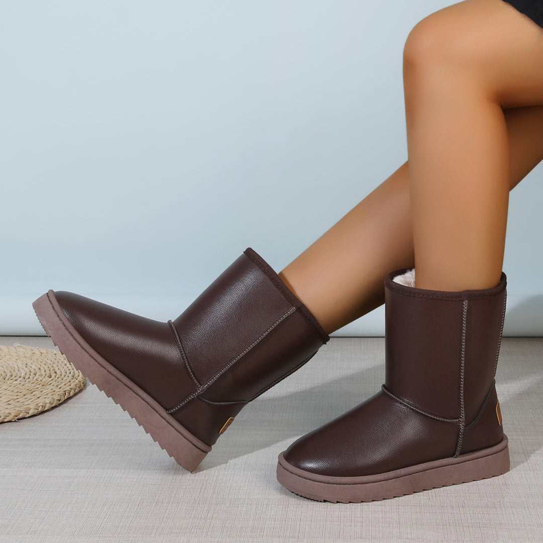 Damen Winterstiefel mit Teddyfutter, Lederoptik und flacher Plateau‑Sohle Echoarchiv