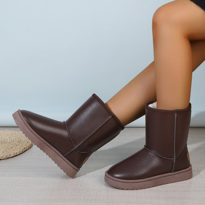Damen Winterstiefel mit Teddyfutter, Lederoptik und flacher Plateau‑Sohle Echoarchiv