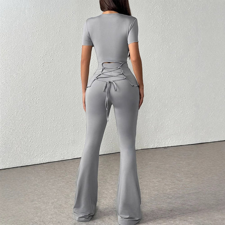Damen elegantes Set aus figurbetontem Oberteil und ausgestellten Hosen Echo Archiv