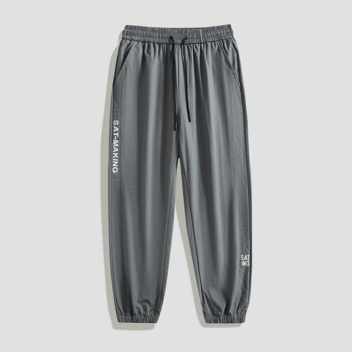 Herren Sportliche Jogginghose mit elastischem Bund und Reißverschlusstaschen Echo Archiv