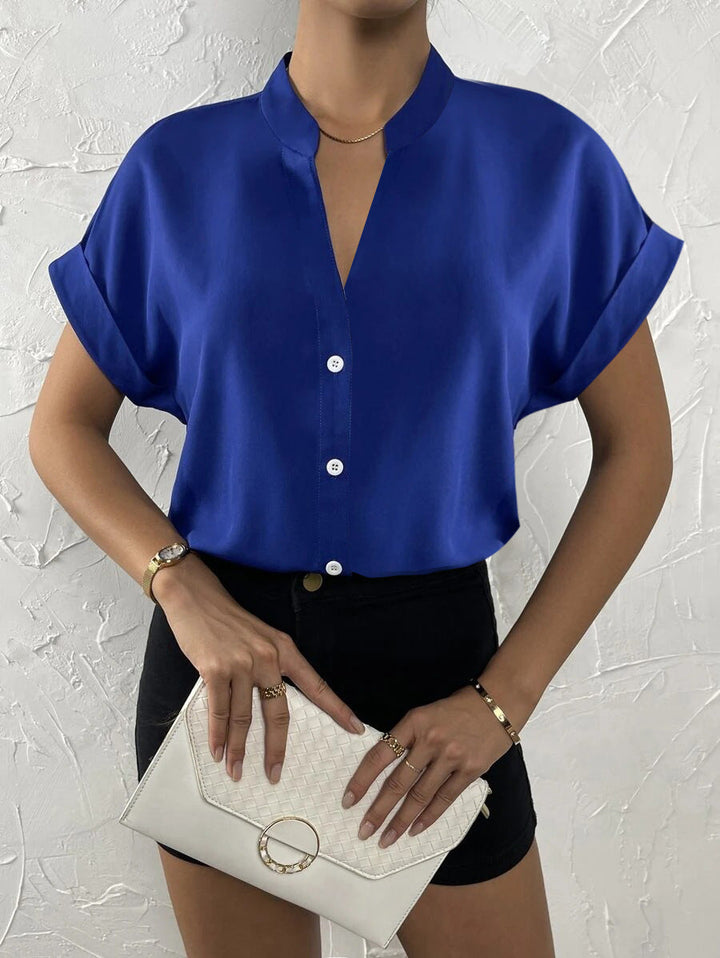 Damen Elegante Kurzarmbluse mit Stehkragen und subtilen Knopfdetails Echoarchiv