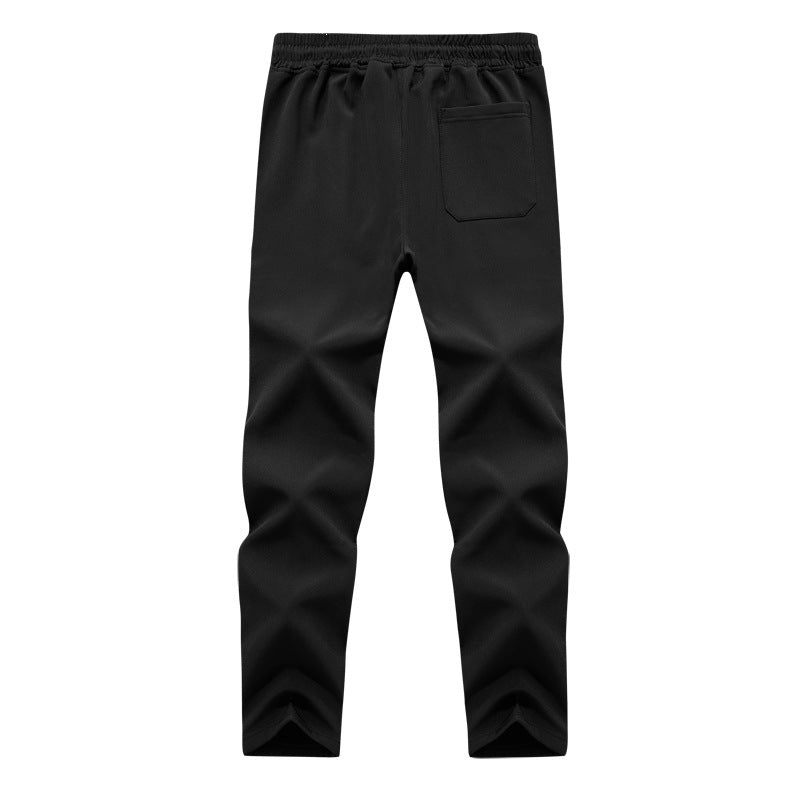 Herren Konisch zulaufende Tech-Jogginghose mit elastischem Bund, Reißverschlusstaschen und atmungsaktivem Funktionsmaterial Echoarchiv