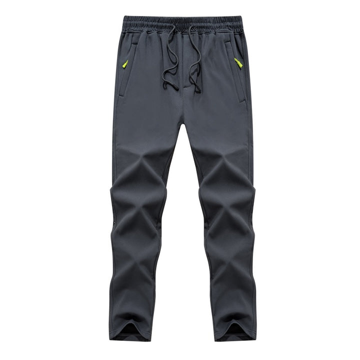 Herren Konisch zulaufende Tech-Jogginghose mit elastischem Bund, Reißverschlusstaschen und atmungsaktivem Funktionsmaterial Echoarchiv