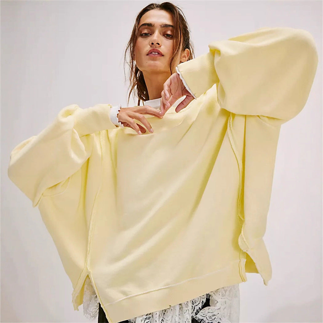 Damen oversized Sweatshirt mit Ballonärmeln, offenen Saumnähten und seitlichen Schlitzen – Avérine