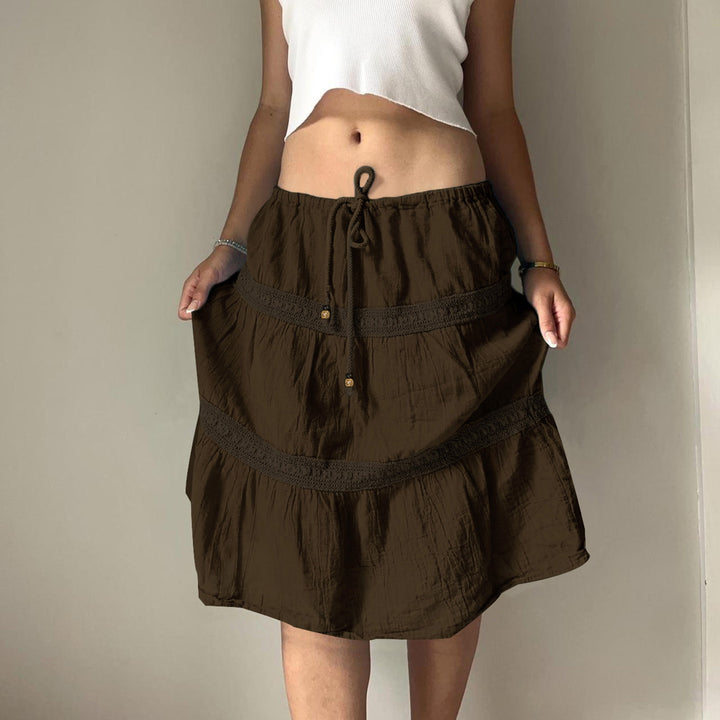 Damen nan gestufter Boho-Midirock mit elastischem Kordelbund und Häkelband-Details Echo Archiv