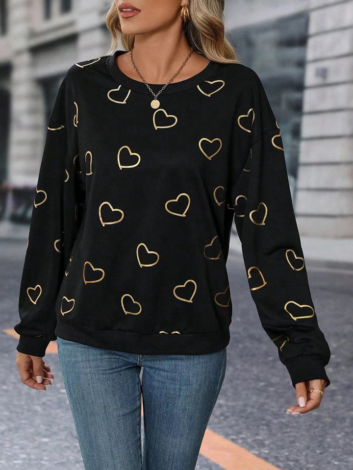 Damen nan lockeres Herzprint-Sweatshirt mit Rundhalsausschnitt und Rippbündchen Echo Archiv