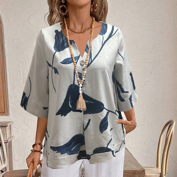 Damen Freizeit Tunika Bluse mit V-Ausschnitt, Schlitzknopf, Dreiviertelärmeln und floralem Oversize-Druck – Élovi