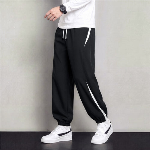 Herren Athleisure Jogginghose im Baggy‑Schnitt mit elastischem Bund, Tunnelzug und seitlichen Kontrastkeilen Echoarchiv