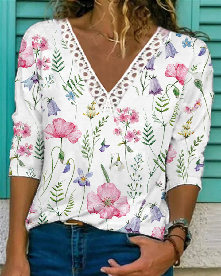 Damenbluse mit V-Ausschnitt und Spitzenbesatz, 3/4-Ärmel, Blumenmuster und lockerer Schnitt Echoarchiv