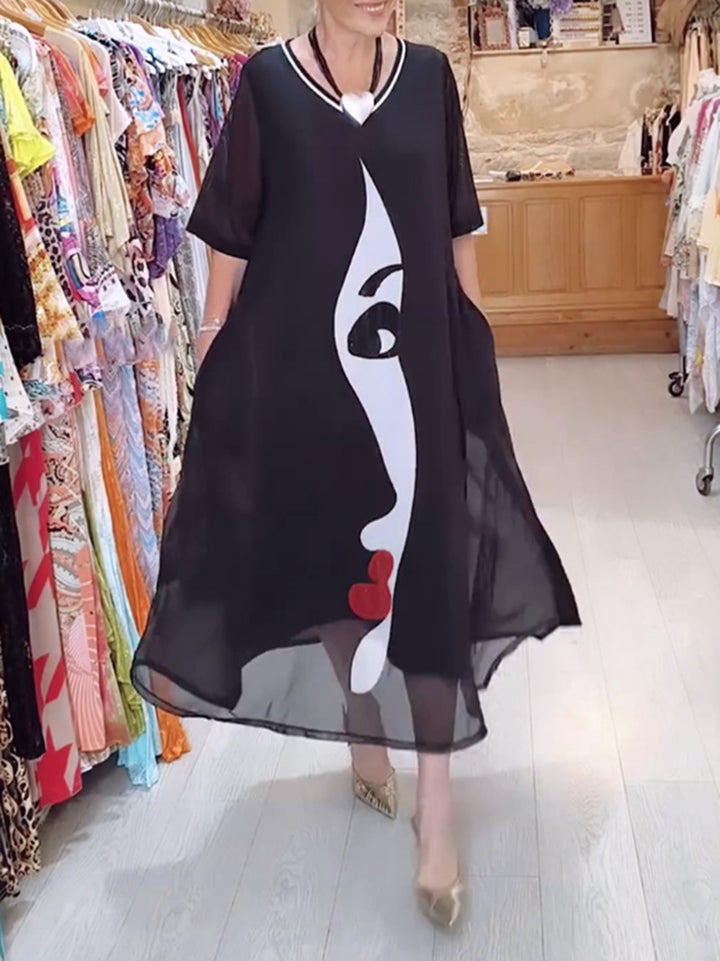 Damen nan luftiges Chiffon-Maxikleid mit grafischem Gesichtsprint, V-Ausschnitt und seitlichen Eingrifftaschen Echo Archiv