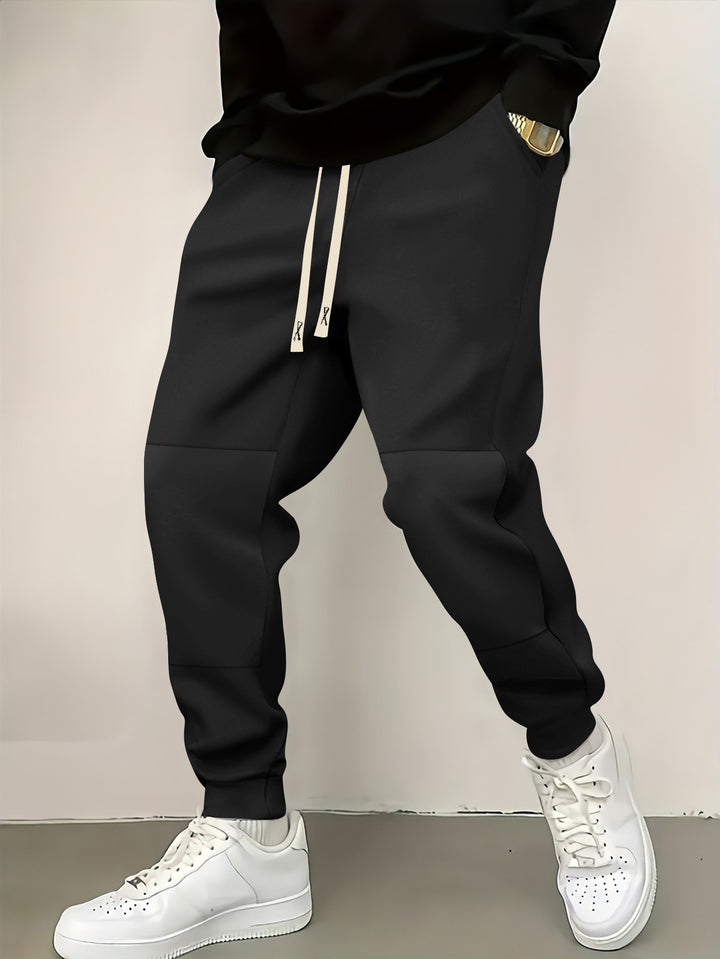 Herren elegante Sporthose mit modernen Farbblockelementen Echoarchiv