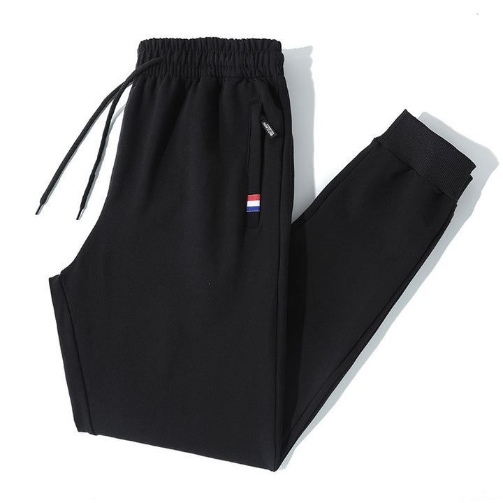 Herren Tapered-Jogginghose mit Tunnelzug, Reißverschlusstasche & Rippbündchen Echo Archiv