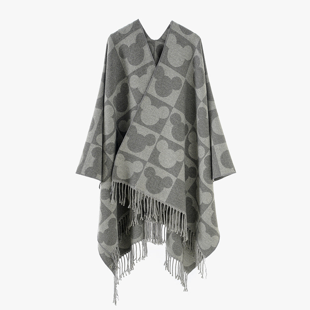 Damen Oversize-Jacquardponcho mit grafischem Kopf-Silhouettenmuster und Fransen – Avérine