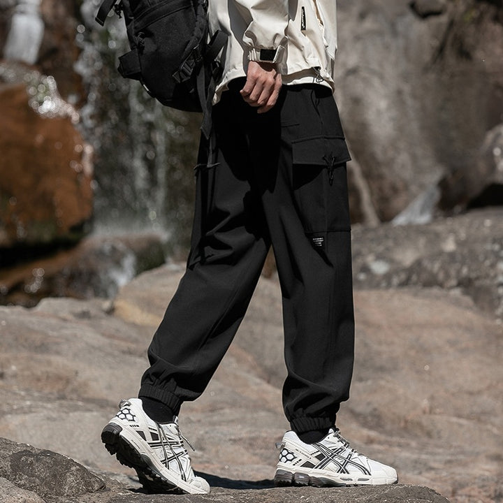 Herren Weite Relaxed-Cargo-Freizeithose mit Tunnelzugbund & Multifunktions‑Taschen Echoarchiv