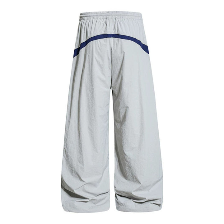 Damen Weite Nylon-Palazzo-Trainingshose mit Tunnelzug, seitlichen Kontrastdreiecken und verstellbarem Saum Echoarchiv