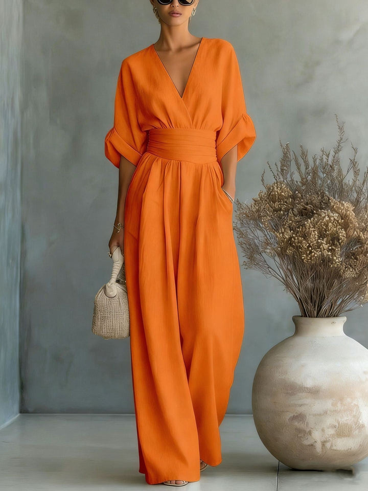 Echoarchiv | Eleganter Ärmelloser Jumpsuit mit Tiefem V-Ausschnitt, Taillenbund und Weitem Bein