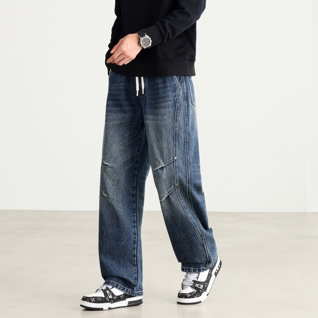 Herren Weite Denim-Hose mit Tunnelzugbund, Paneelnähten und Used-Waschung Echo Archiv