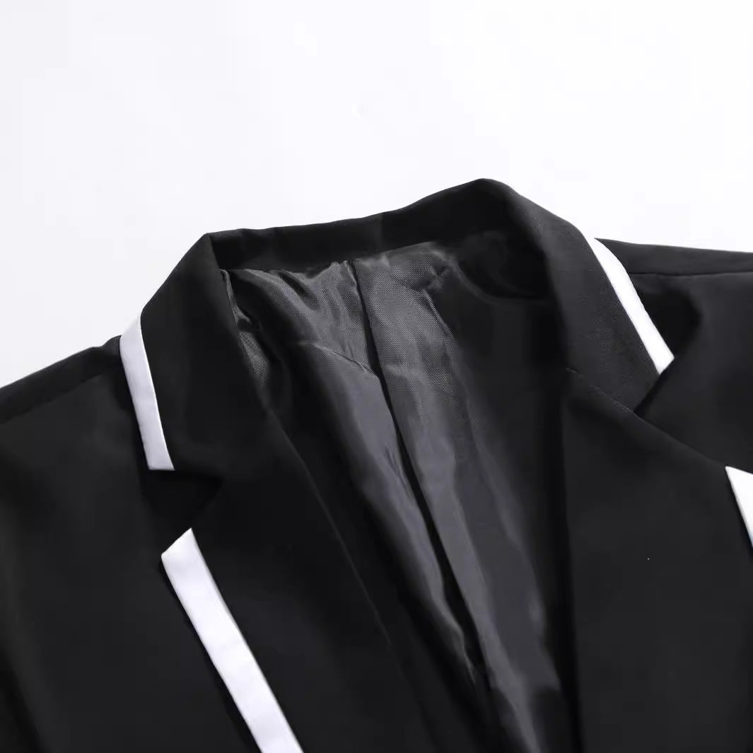 Herren eleganter Anzug mit kontrastierendem Revers Echoarchiv