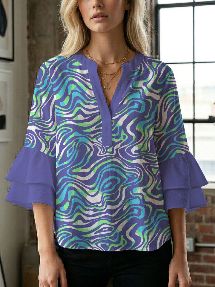 Damen Bluse mit voluminösen Flügelärmel und intensivem Blattmuster Echo Archiv
