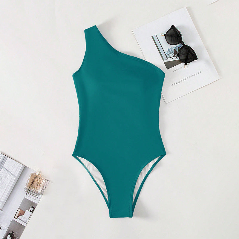 Damen Einteiler Badeanzug mit asymmetrischem Schnitt und hohem Beinausschnitt Echo Archiv