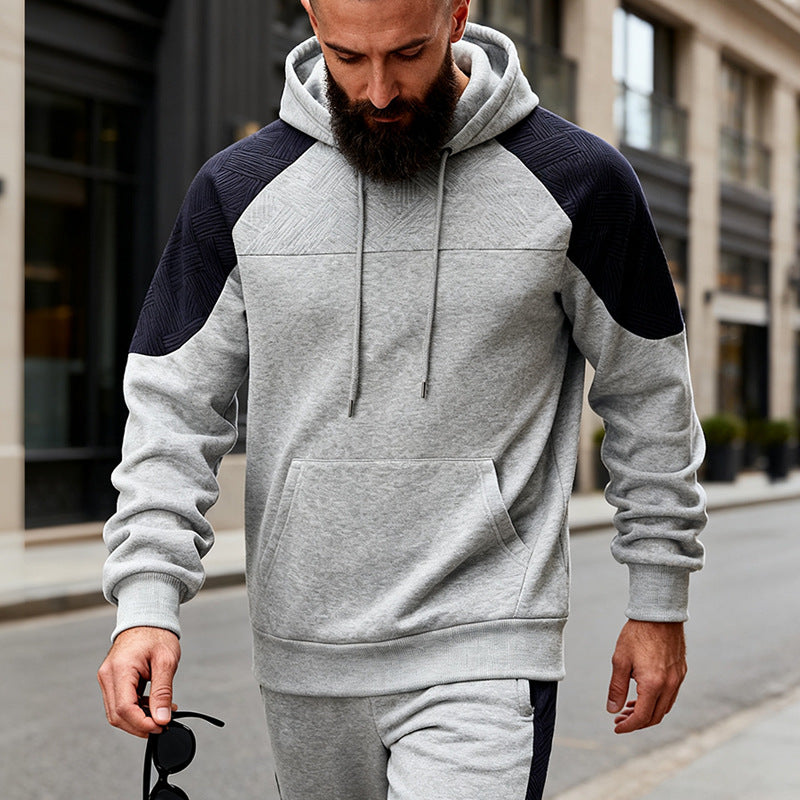 Herren sportlicher Kapuzenpullover mit strukturierten Ärmelpanels Echoarchiv
