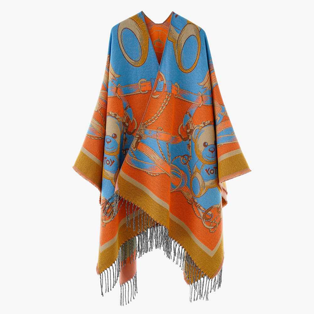 Damen Jacquard-Poncho mit Fransen und illustrativem Teddy-Sattel-Motiv – Avérine