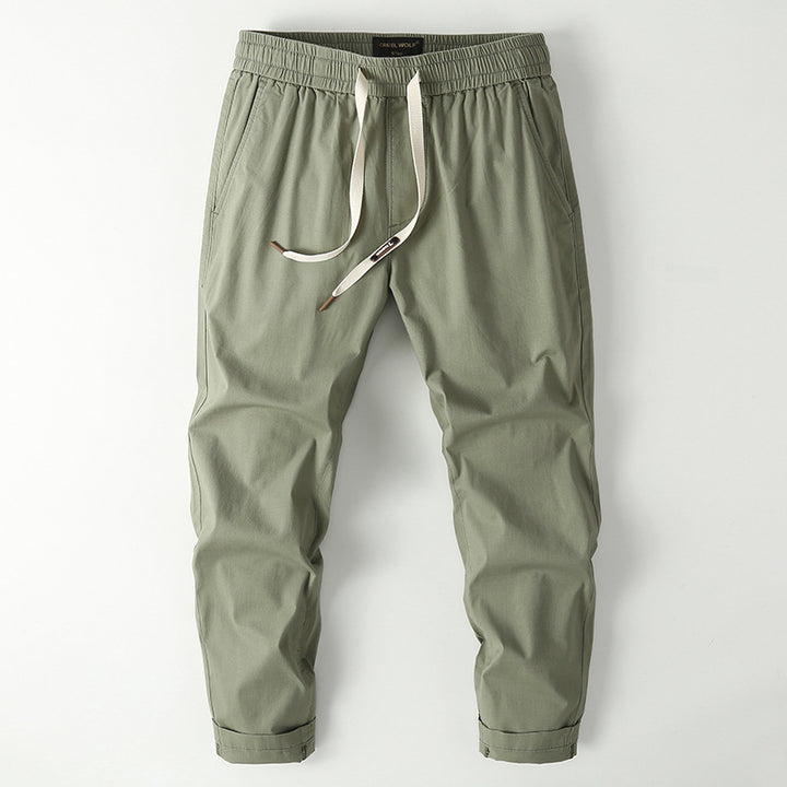 Herren Elastische Chino-Jogger mit tailliertem Tapered-Schnitt und aufgesetzter Gesäßtasche Echoarchiv