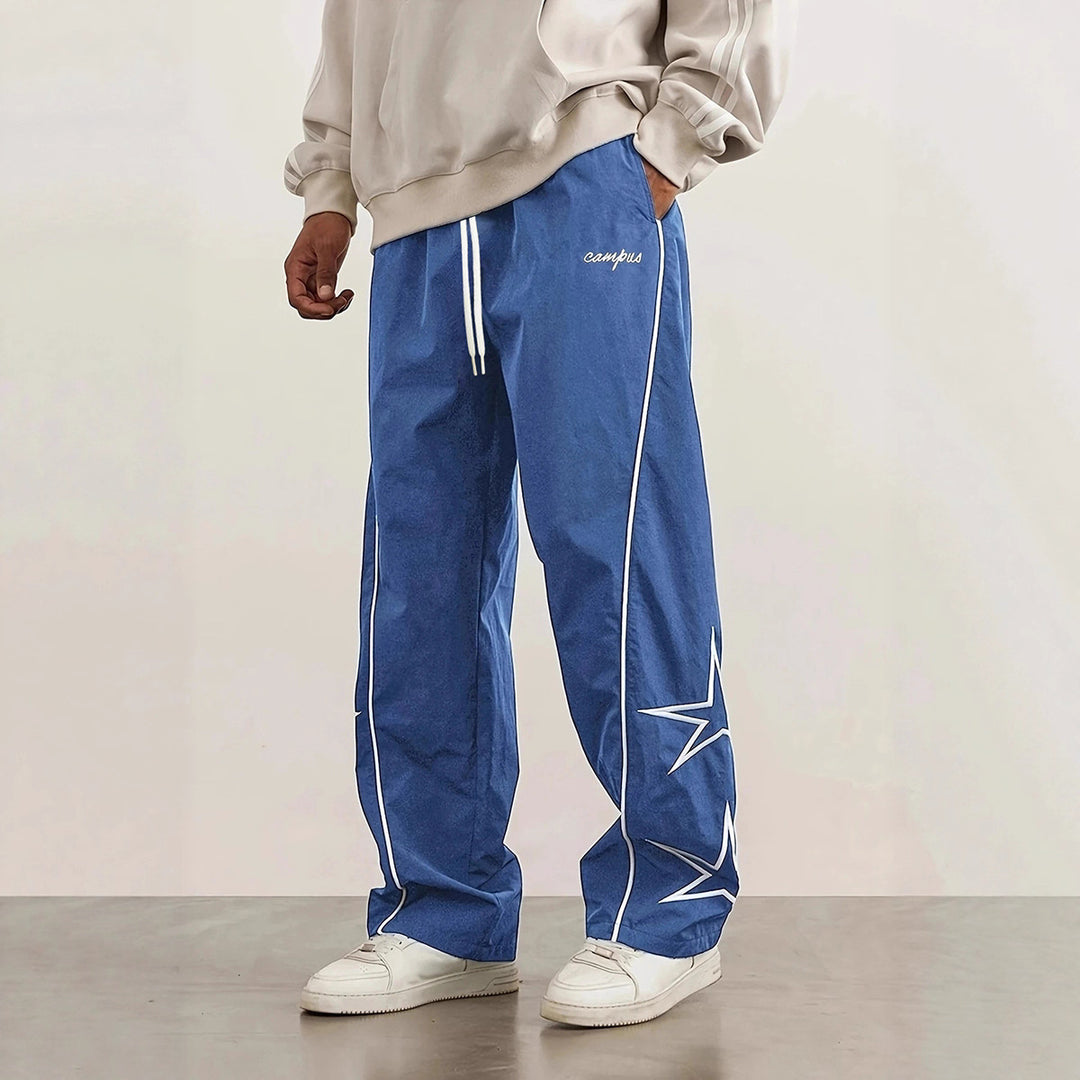 Herren Weite Trackpants mit Kontrastpaspel, Kordelzug und Sternapplikation Echo Archiv