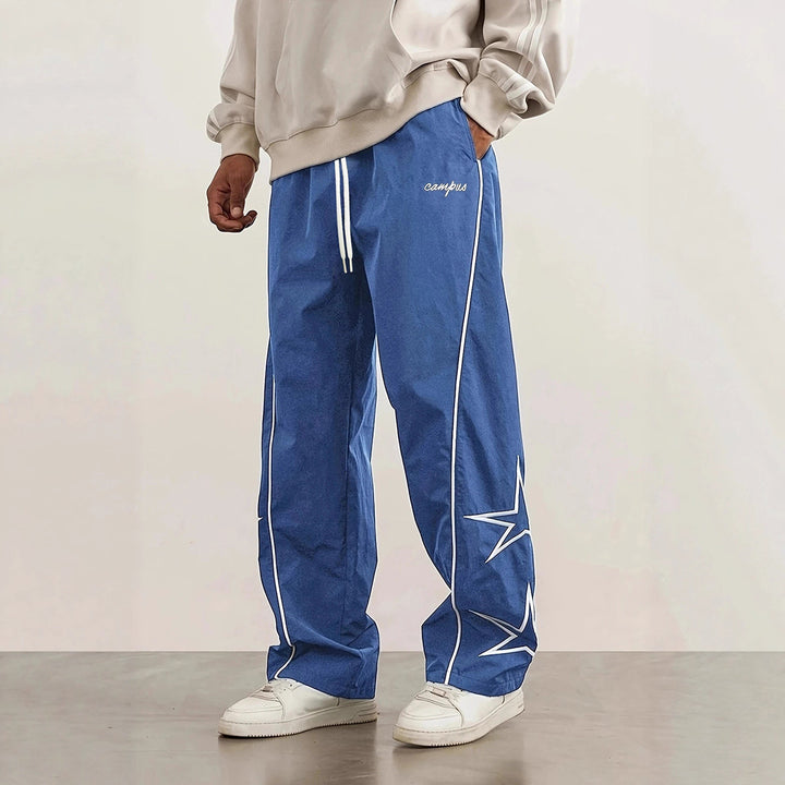 Herren Weite Trackpants mit Kontrastpaspel, Kordelzug und Sternapplikation Echo Archiv