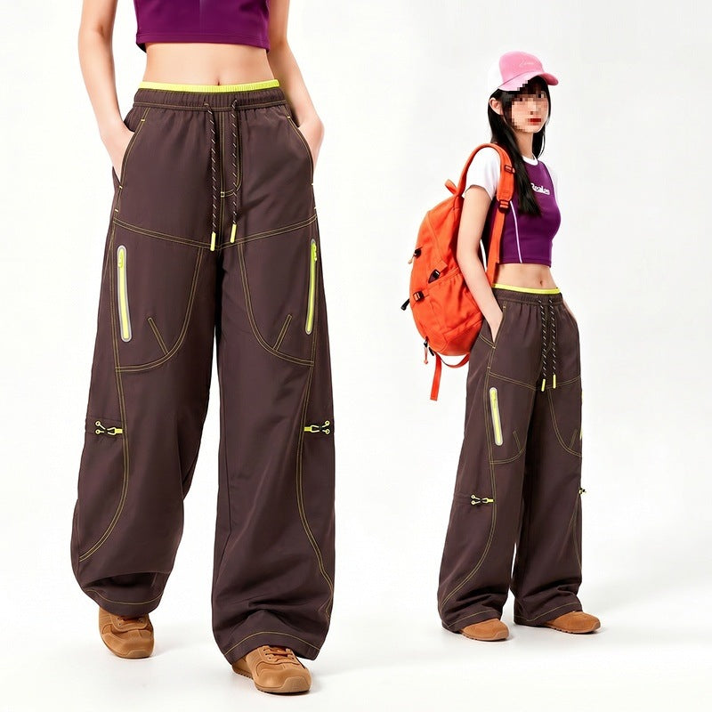 Damen Oversize Tech-Loungehose mit Kontrastnähten, reflektierenden Reißverschlusstaschen & Kordelbund Echoarchiv