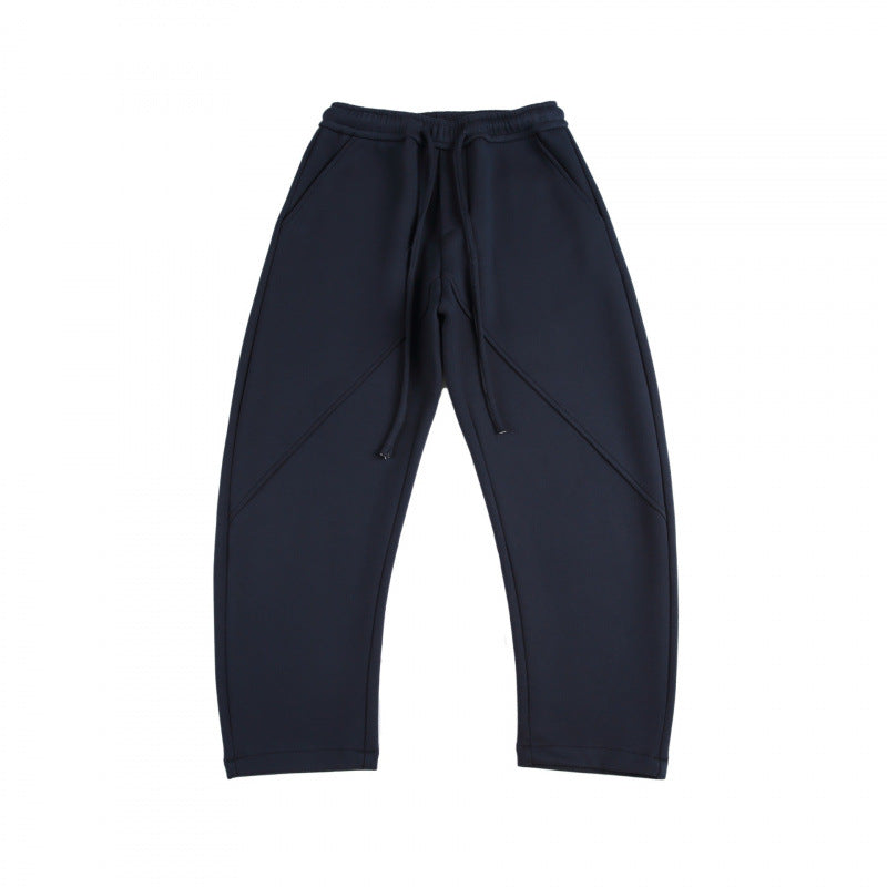 Unisex Weite Tech-Jogginghose mit diagonalem Nahtdesign, Elastikbund und Tunnelzug Echo Archiv