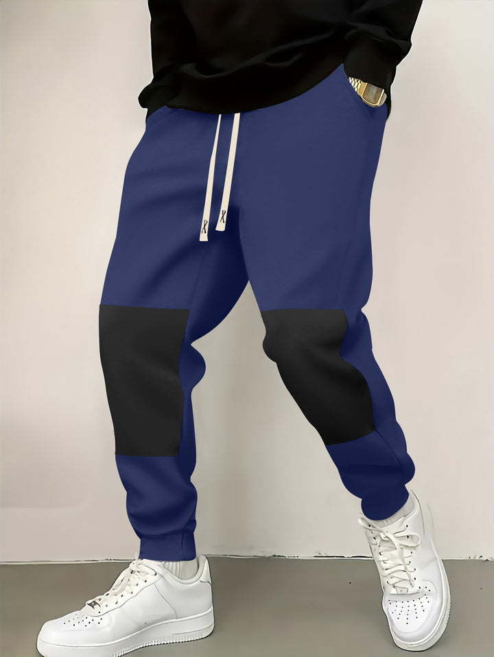 Herren elegante Sporthose mit modernen Farbblockelementen Echoarchiv