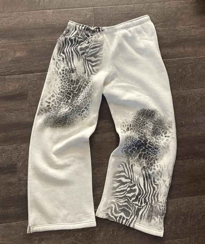 Damen nan lockere Sweathose mit asymmetrischem Animal-Print, elastischem Komfortbund und geradem Bein Echo Archiv