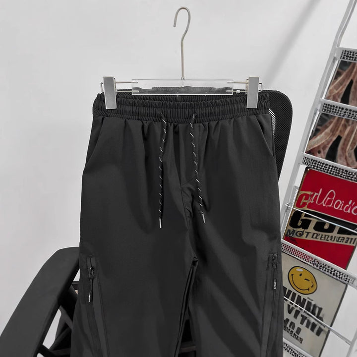 Unisex Sportliche Jogginghose mit verstellbarem Bund und Seitentaschen Echoarchiv