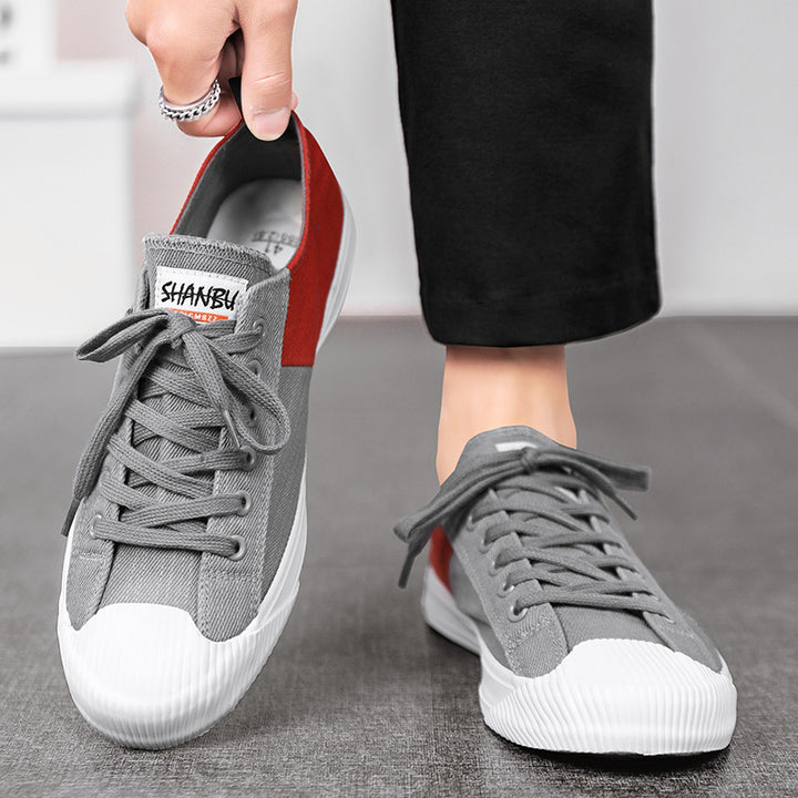 Unisex niedrige Canvas-Sneaker mit verstärkter Gummi-Zehenkappe und kontrastierenden Textilpaneelen – Norré