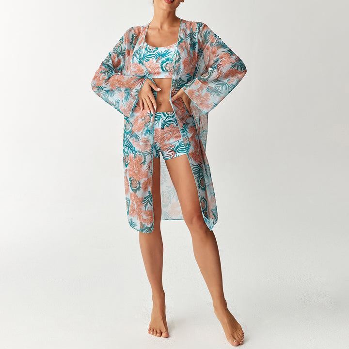 Damen Strandoutfit mit floralem Design und transparentem Kaftan Echo Archiv