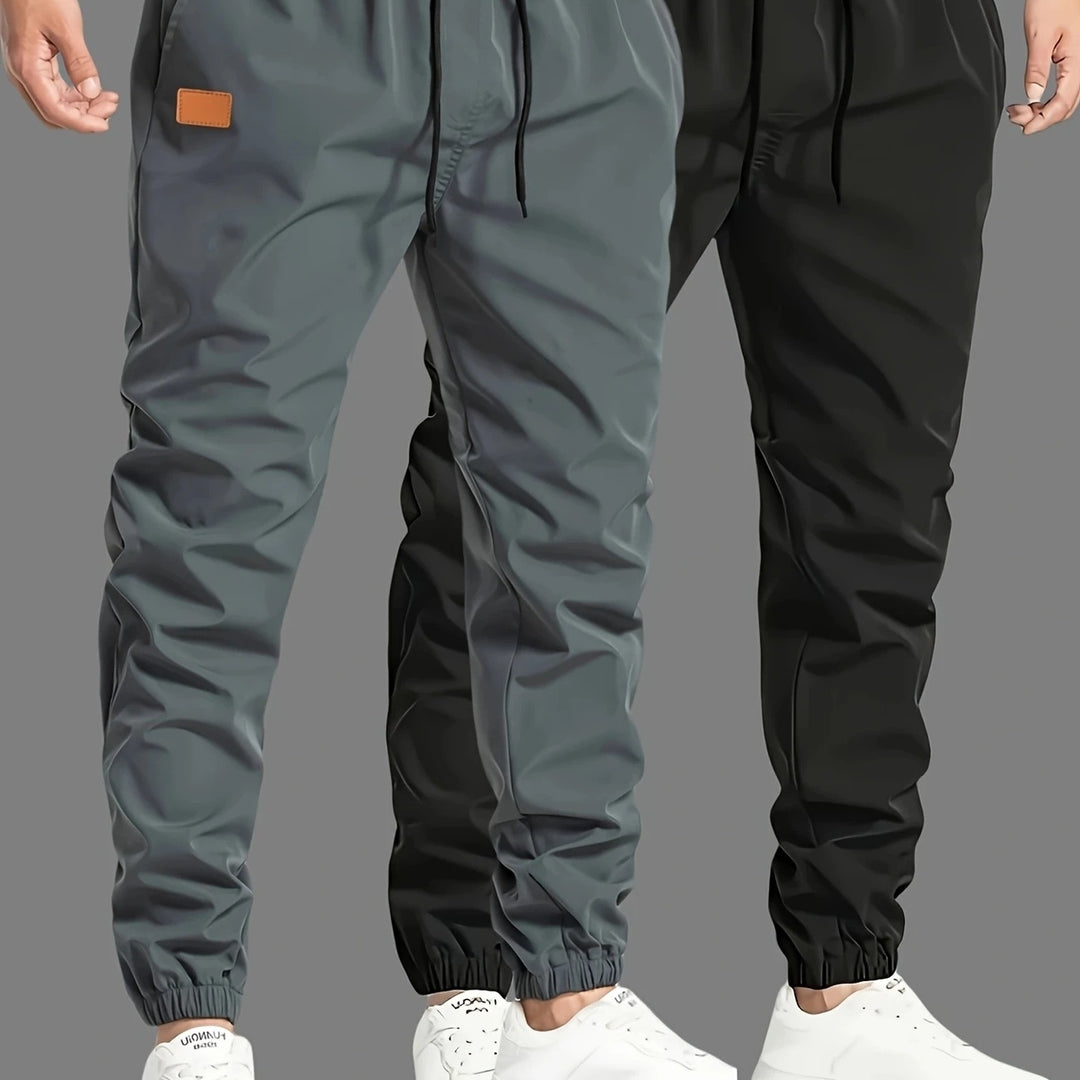 Herren Slim‑Tapered Tech‑Joggerhose mit Tunnelzugbund, elastischen Knöchelbündchen und funktionalen Seitentaschen Echo Archiv