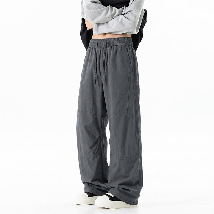 Herren Weite Baggy‑Hose mit Tunnelzugbund und Paneel‑Konstruktion Echo Archiv