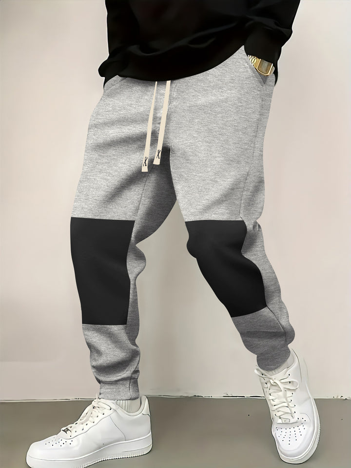 Herren elegante Sporthose mit modernen Farbblockelementen Echoarchiv