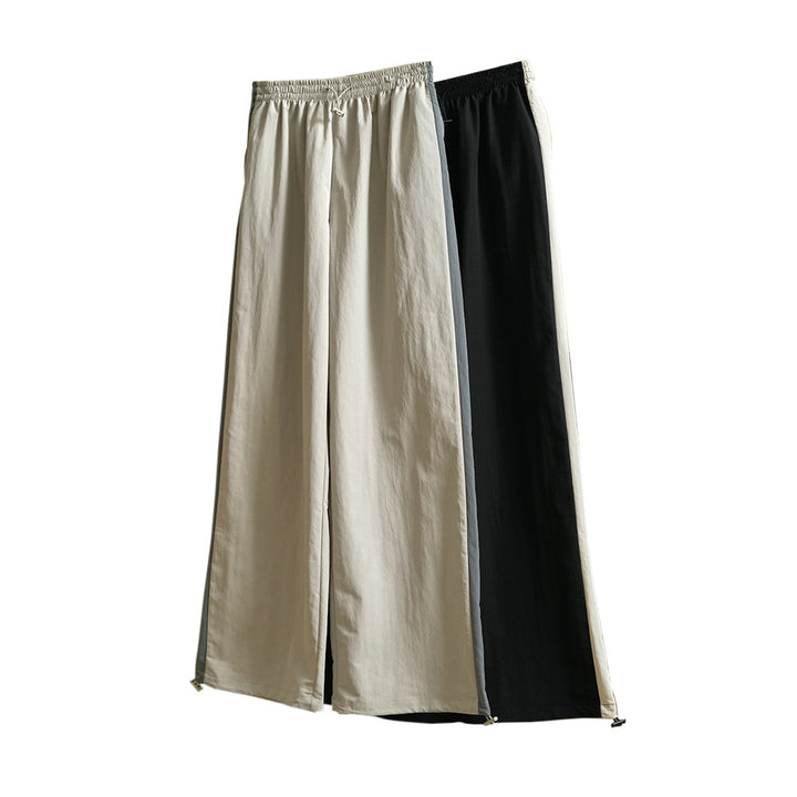 Damen Weite High‑Waist Trackhose im Palazzoschnitt mit kontrastierendem Seitenstreifen Echoarchiv