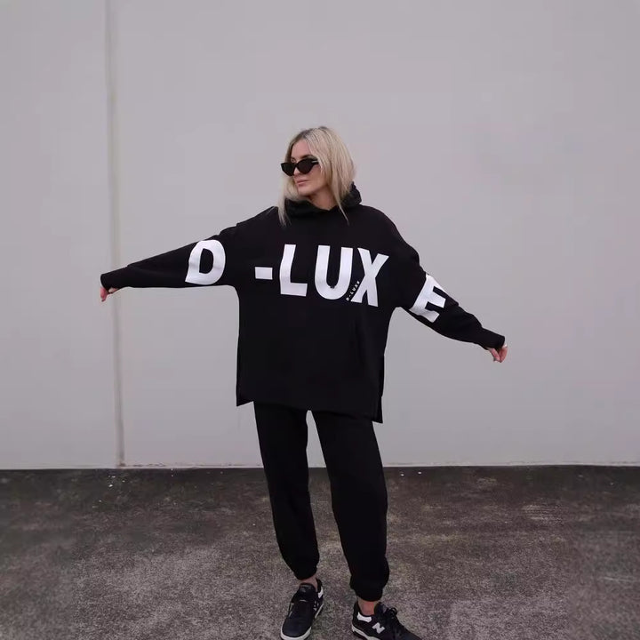 Damen Oversized Kapuzenpullover mit markantem Logoprint, Kängurutasche und Seitenschlitzen Echoarchiv