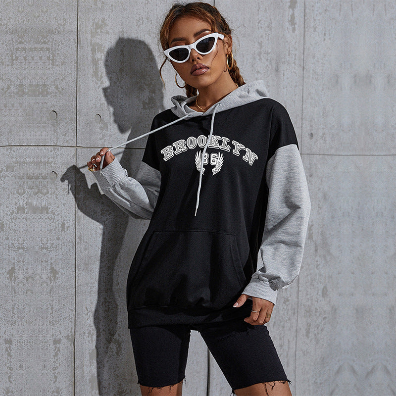 Damen Oversize-Kapuzenhoodie im Collegestyle mit Colorblock-Ärmeln, Kängurutasche und Kordelzug Echoarchiv
