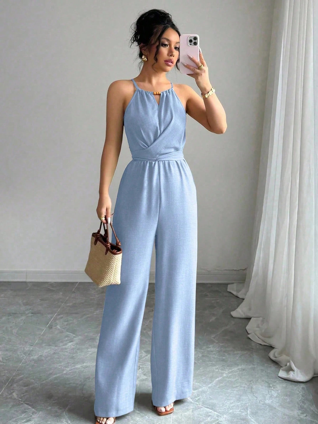 Damen Ärmelloser Neckholder-Jumpsuit mit Wickeloberteil und weitem Bein Echo Archiv