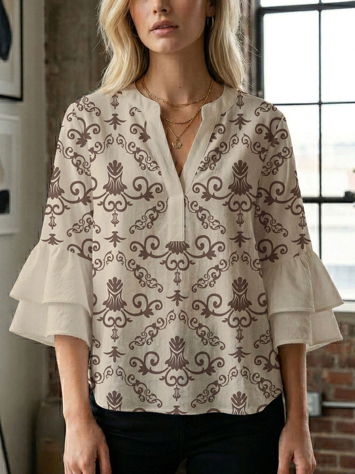 Damen Blusenshirt mit voluminösen Ärmeln und kreativem Druckdesign Echo Archiv