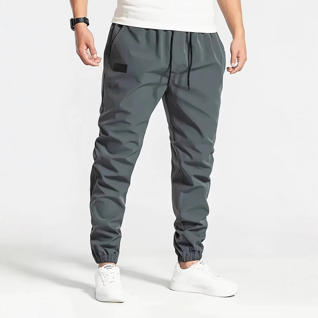 Herren Technische Jogginghose im Tapered‑Utility‑Stil mit elastischem Bund & Knöchelbündchen Echo Archiv