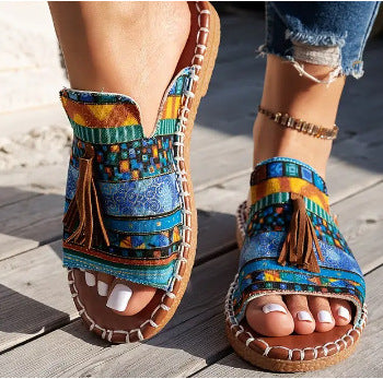 Damen Ethno-Slipper-Sandalen mit Quaste und handgenähter Ziernaht – Sorelia