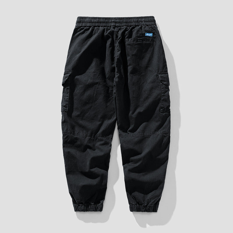 Herren Leichte Canvas-Cargohose im Joggerstil mit elastischem Bund, segmentierten Kniepaneelen und verdeckten Klappentaschen Echo Archiv