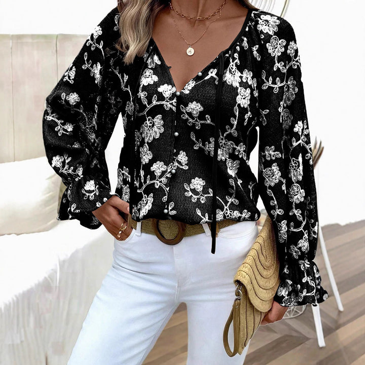 Damen V‑Neck Bluse mit floraler Stickerei, Perlenknopfleiste und Ballonärmeln – Avérine