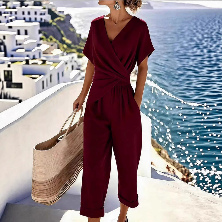 Damen Eleganter Jumpsuit mit Wickeloptik und breiten Beinen Echo Archiv