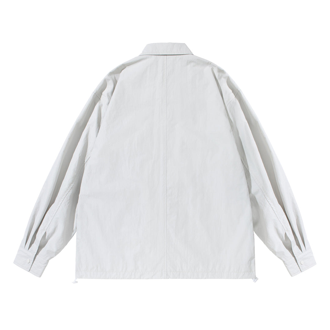 Unisex Oversize-Hemdjacke mit Druckknopfleiste und Pattentaschen Echoarchiv
